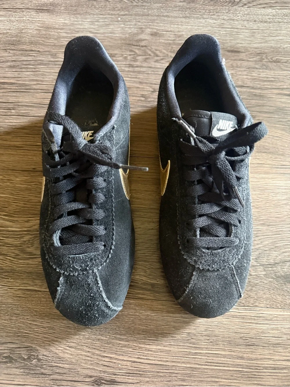 Nike Men’s Black Suede Sneakers with Gold Swoosh